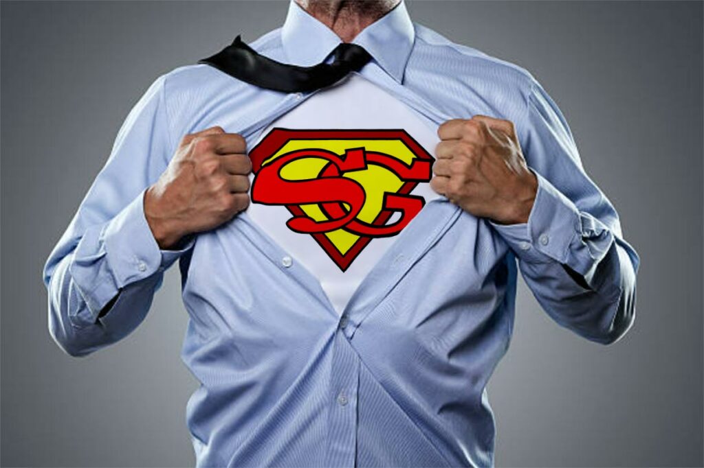 homme d'affaires ouvrant sa chemise, laissant apparaitre un tee-shirt superman